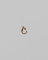 CRZM Mini Letter C set in solid gold on light color background.