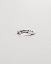 Platinum Solid Round Wire Mini Curve Band on light color background.