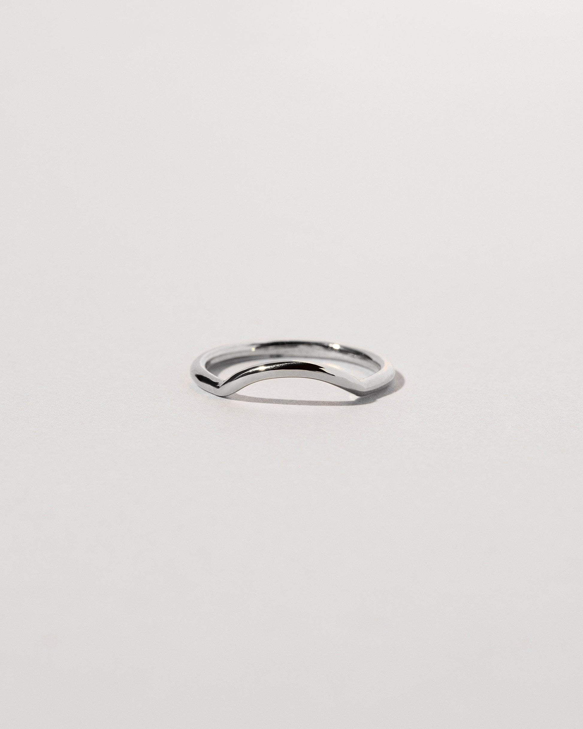 Platinum Solid Round Wire Mini Curve Band on light color background.