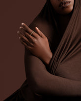 Styled image featuring the Gold Pavé Twist Band on model.