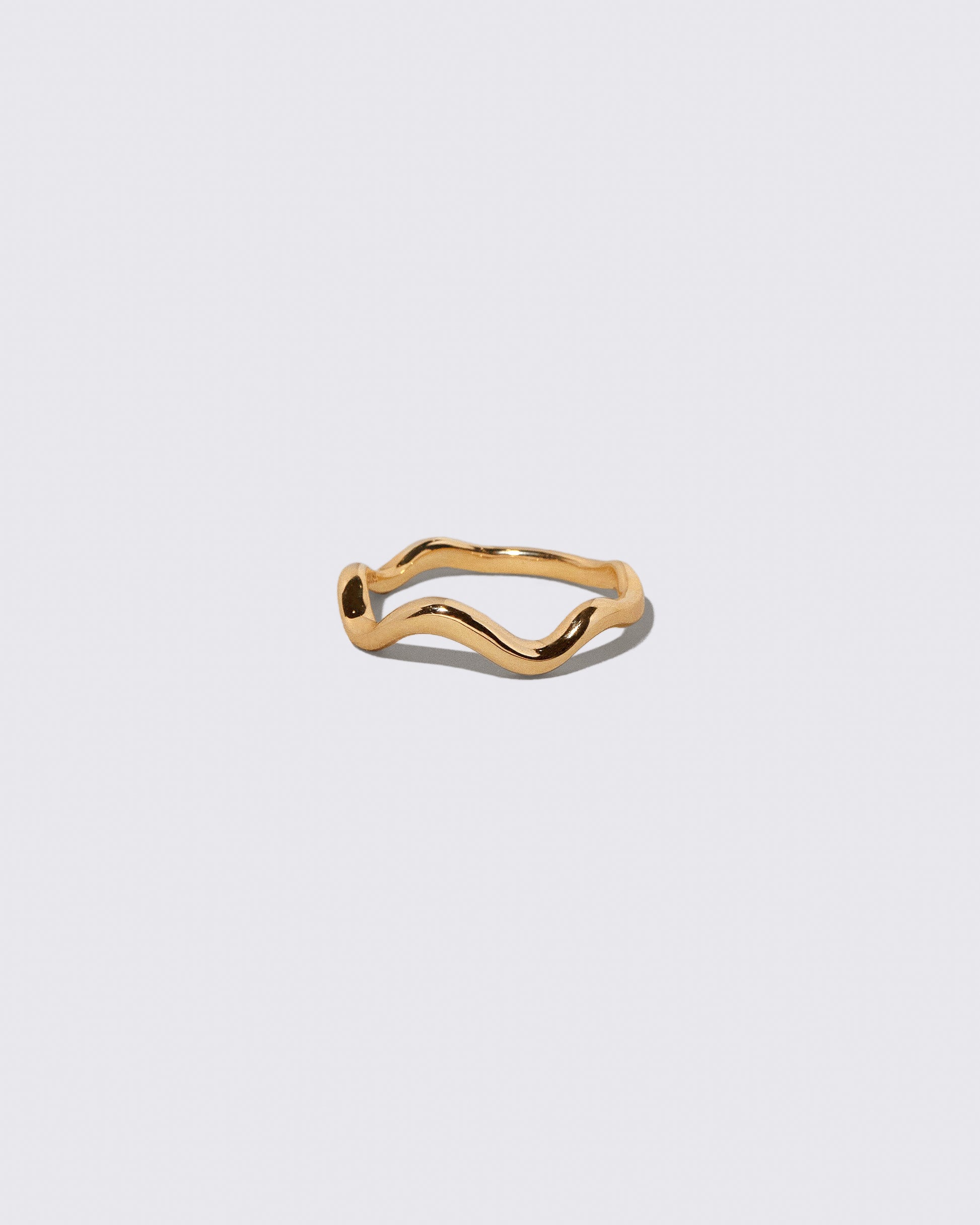 Gold Bump Band on light color background.