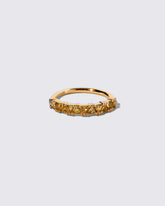 Yellow Sapphire Eleven Trillion Ring on light color background.