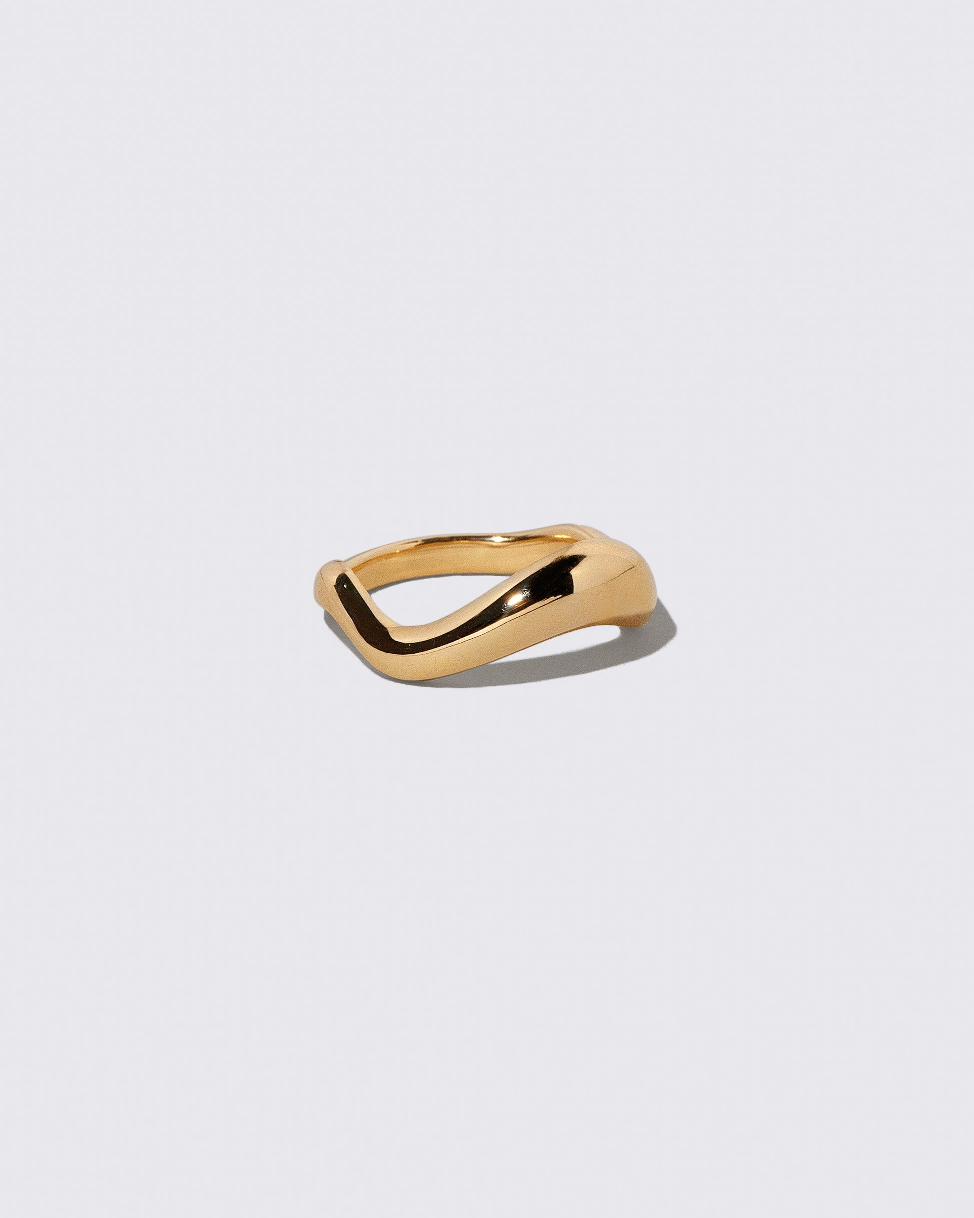 View from the side of the Gold Equate Band on light color background.