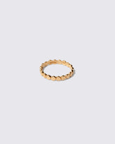 Gold One Tier Mimosa Band on light color background.