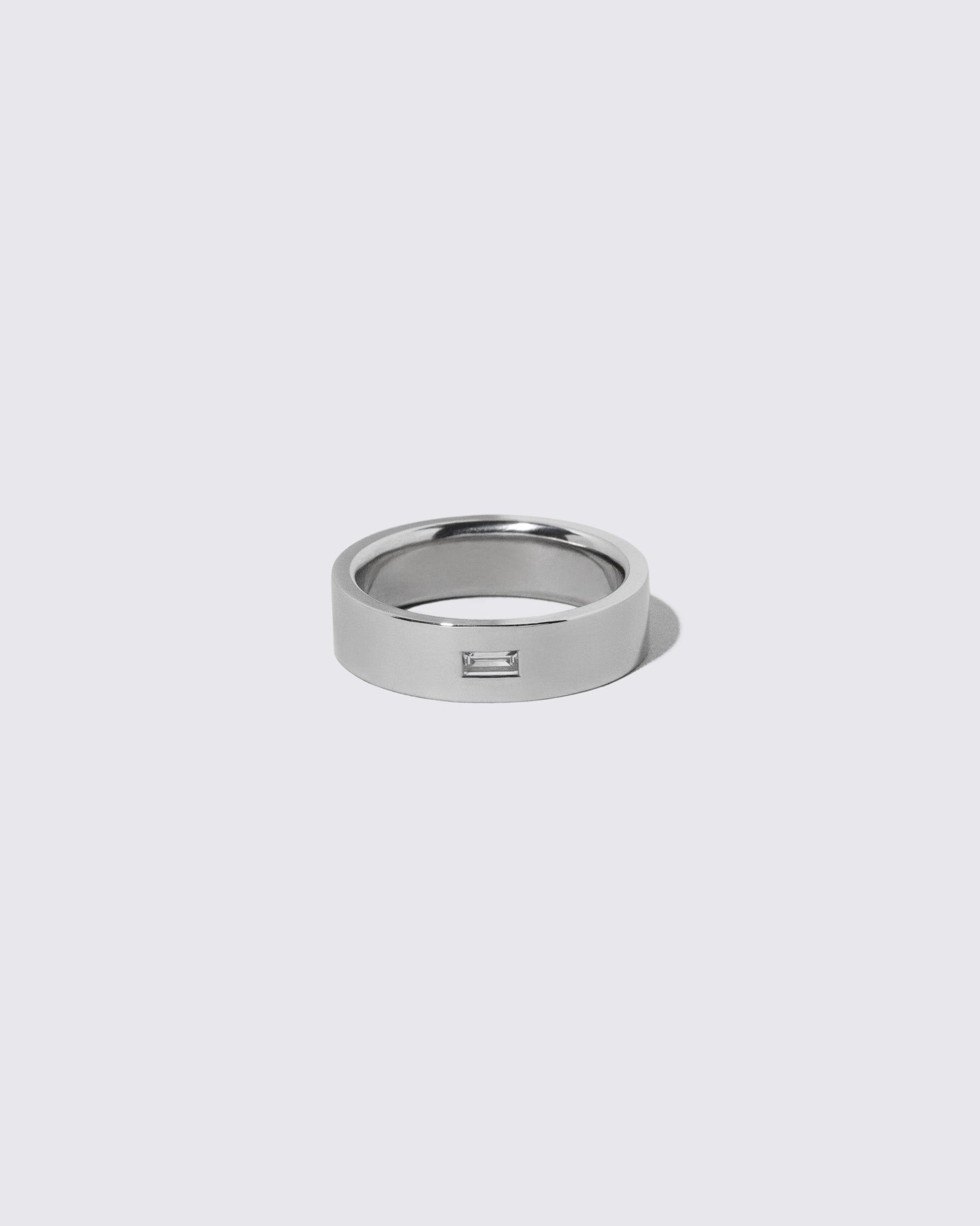 Platinum Diamond East West 6mm Baguette-Set Piet Band on light color background.