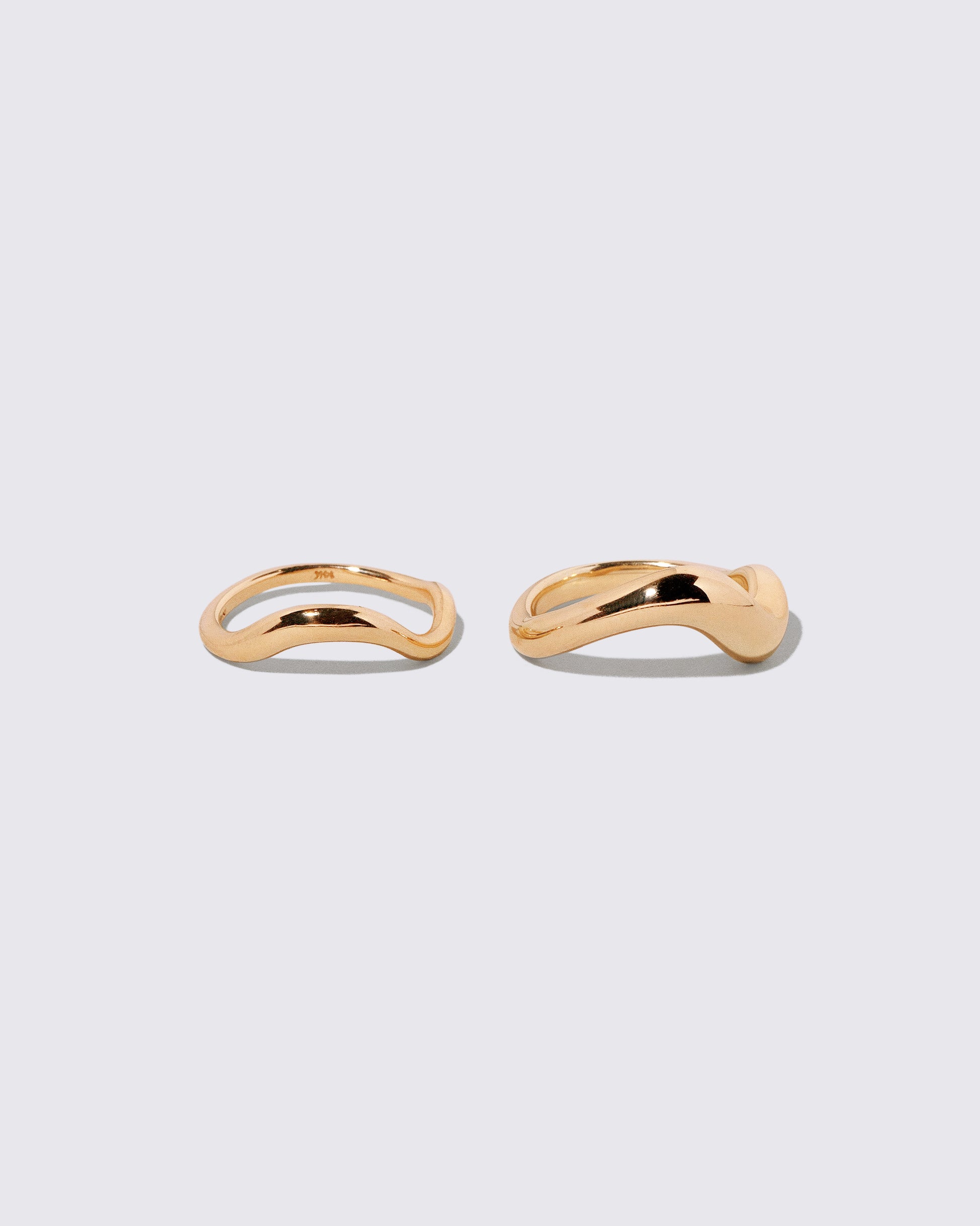 Gold Precise Band and Gold Unbroken Band on light color background.