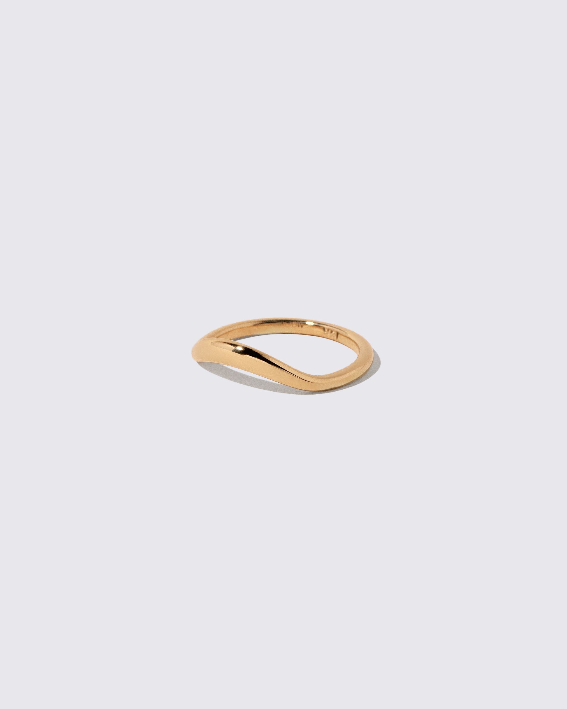 View from the side of the Gold Thin Level Band on light color background.