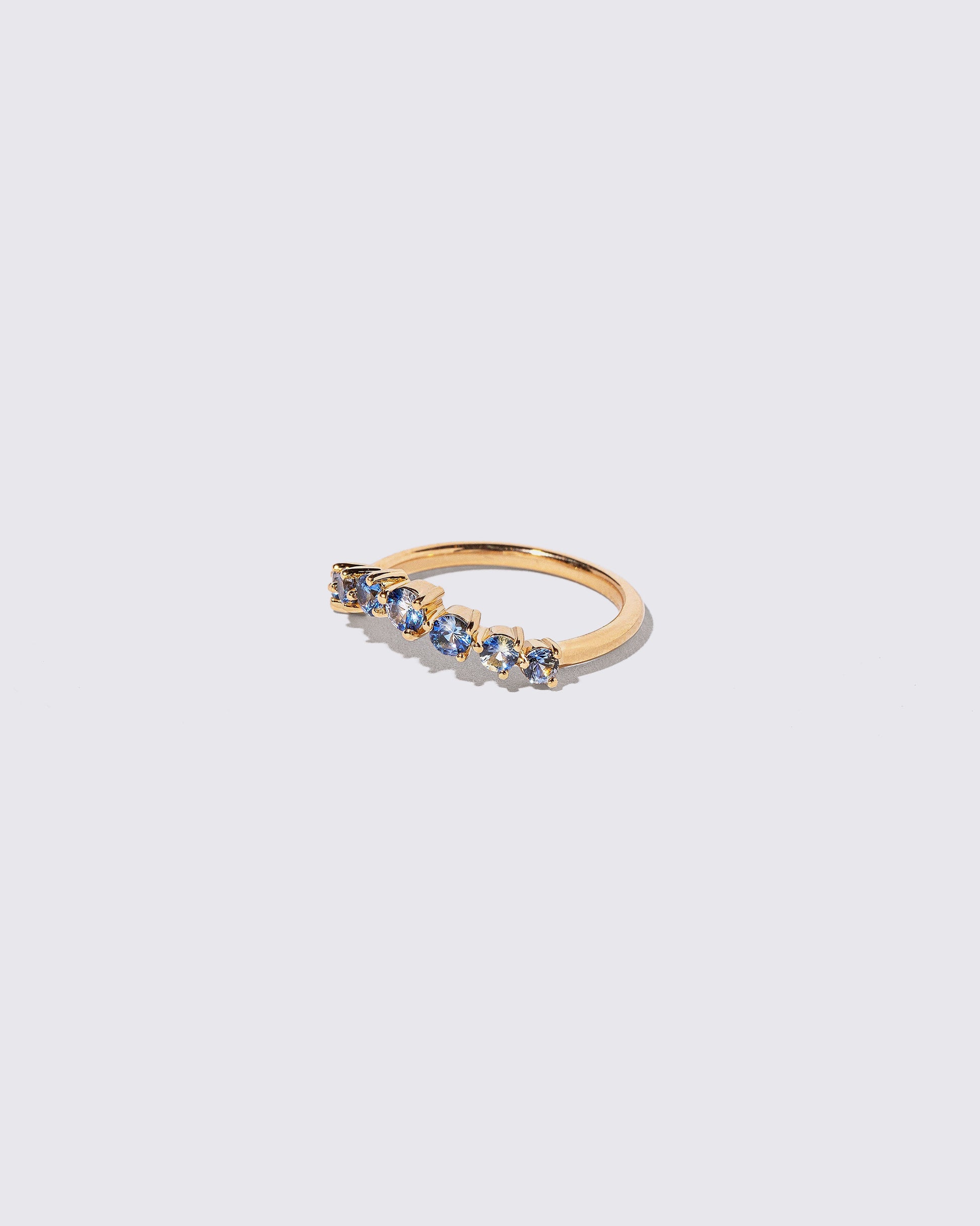 View from the side of the Sapphire Wave Band on light color background.