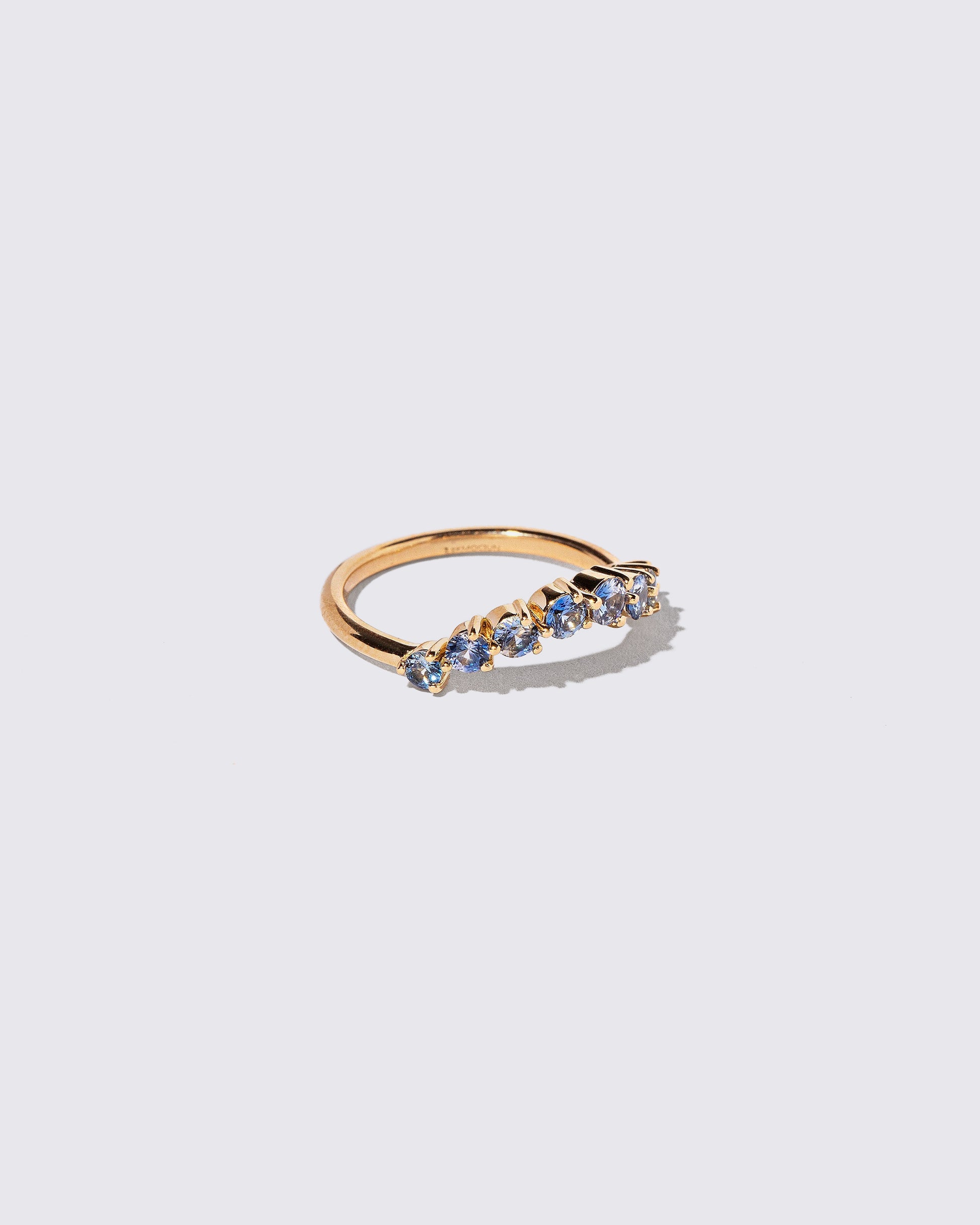 View from the side of the Sapphire Wave Band on light color background.