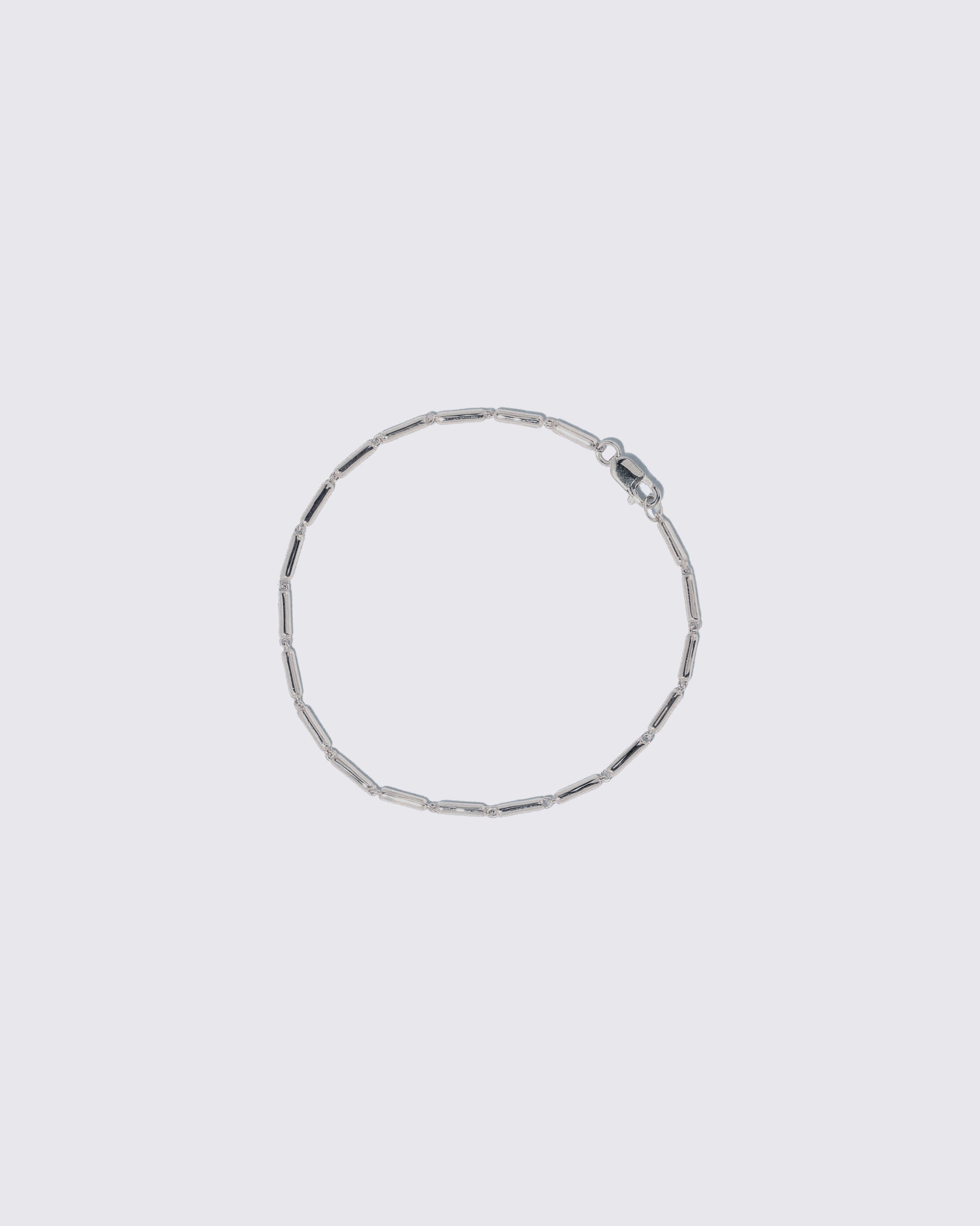 Platinum Butter Chain Bracelet on light color background.