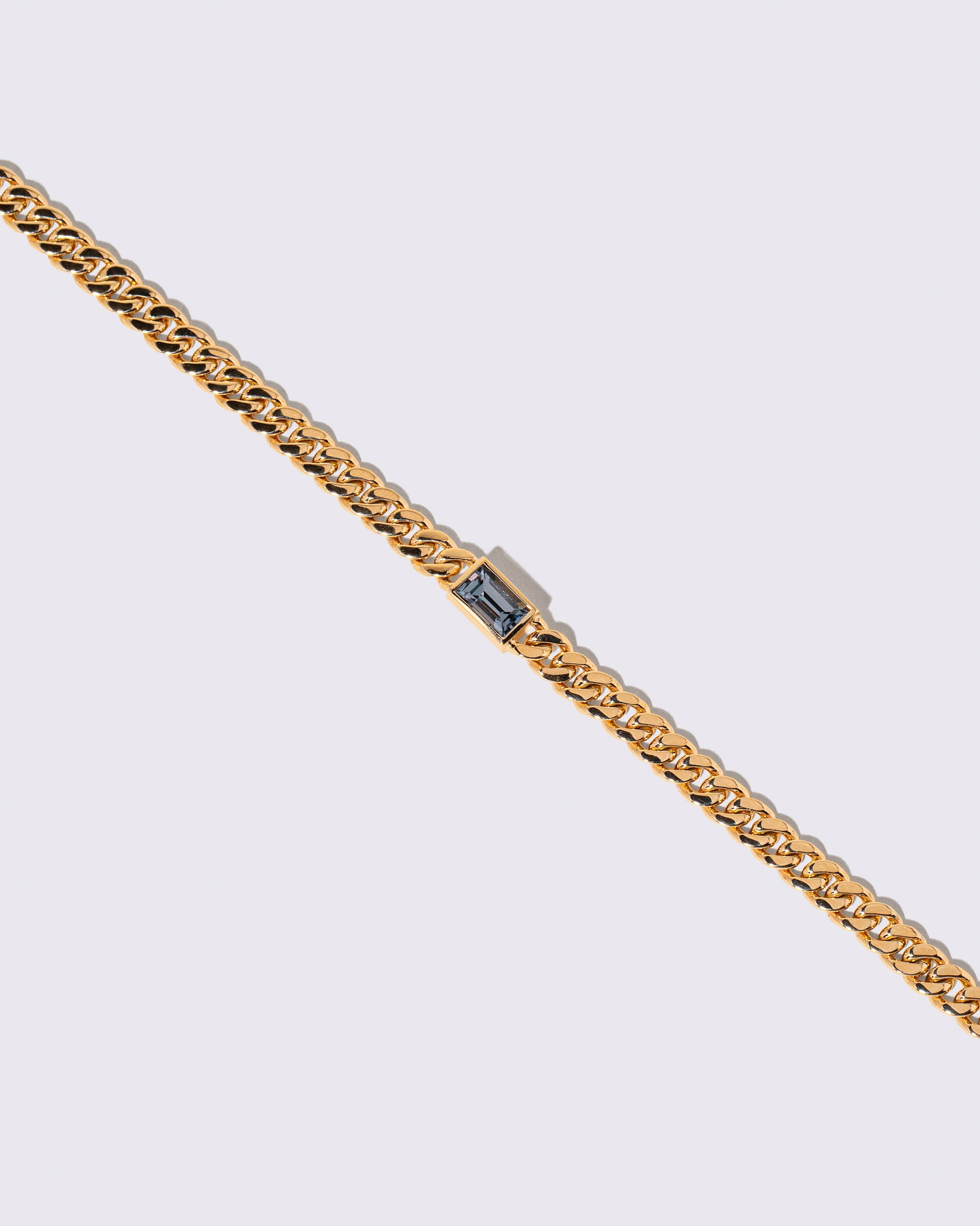Closeup details of the Identity Chain Gray Spinel Bracelet 001 on light color background.