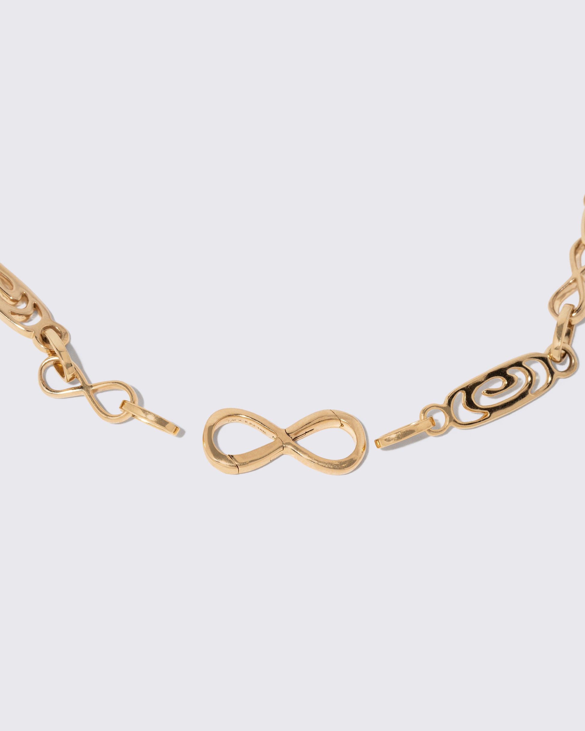 Detail view of the detachable Infinity Openable Link closure on the Infinity Openable Link Bracelet on light color background.