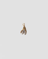 Bruised Banana Peel Charm on light color background.