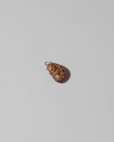 Bengal Curled-Up Cat Charm on light color background.