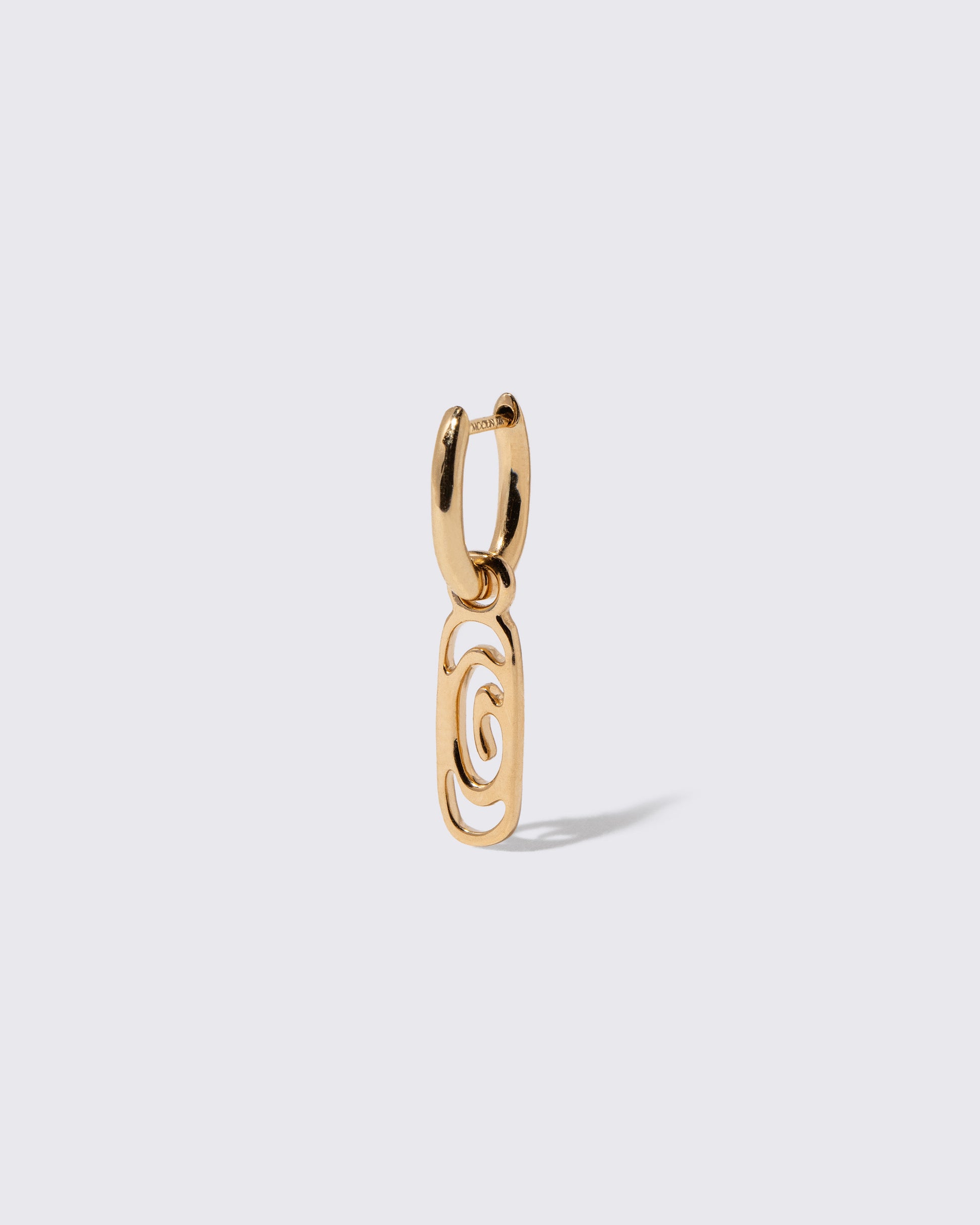 Closeup details of the Styling Huggie Hoop Earring Single and Infinite Spiral Styling Link on light color background. Earring sold separately.