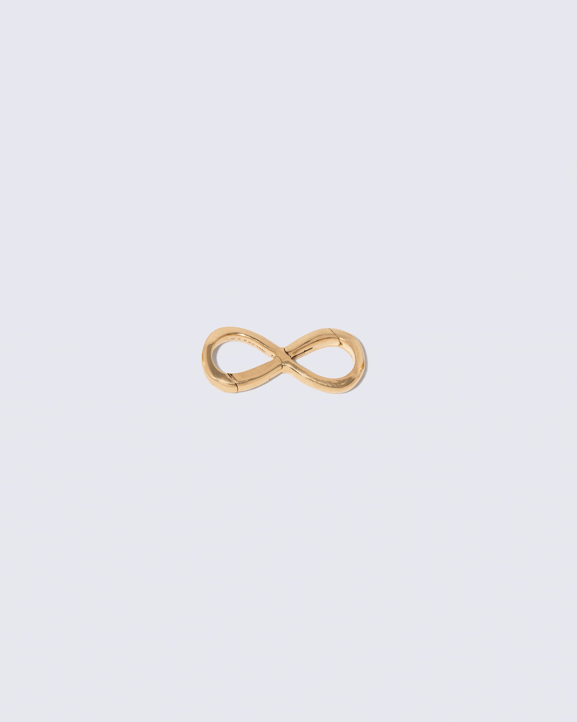 Animated detail view of the double sided Infinity Openable Link included as closure with the namesake necklace on light color background.