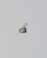 Instant Ramen Charm on light color background.