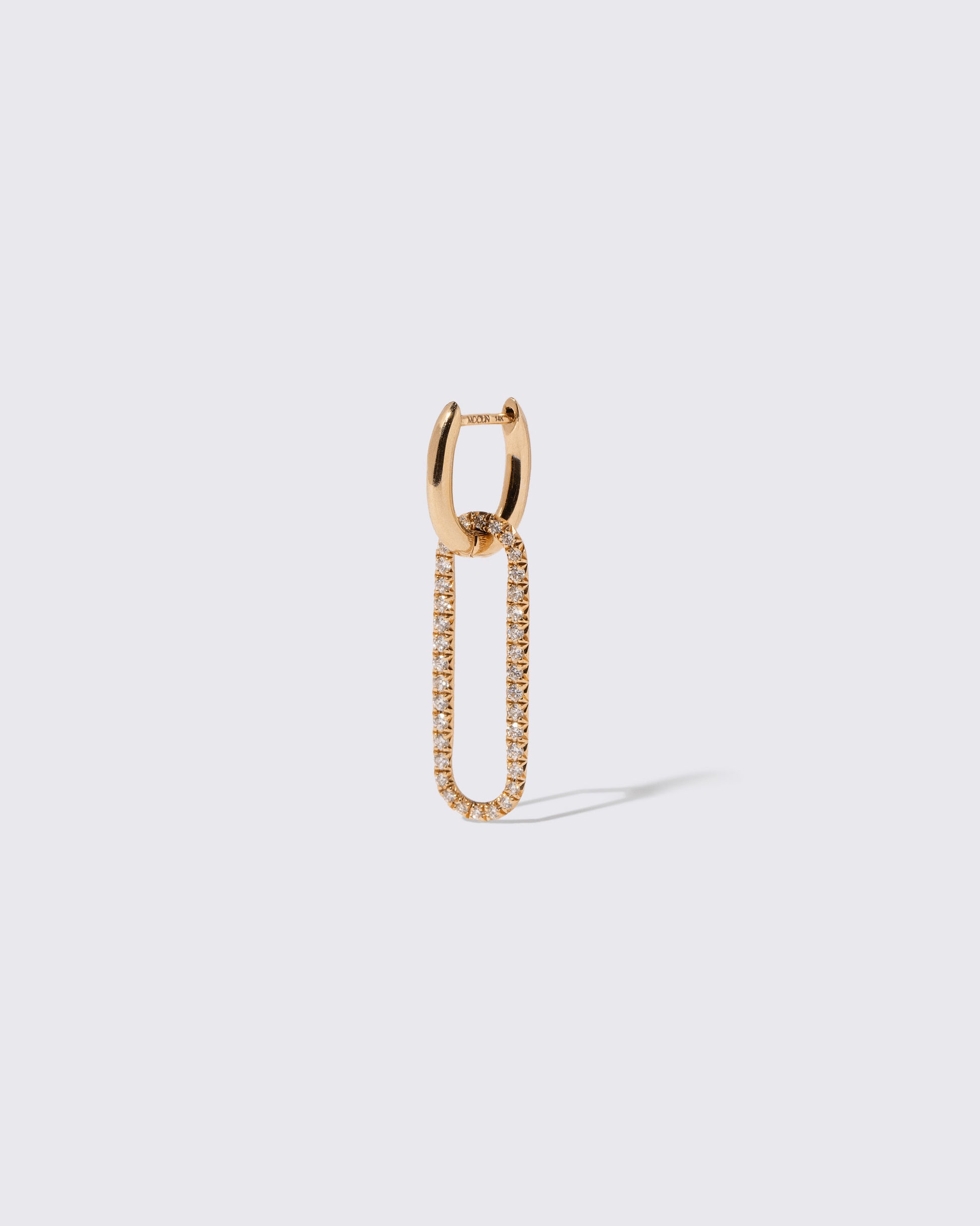 Closeup details of the Styling Huggie Hoop Earring Single and Pavé Styling Link on light color background. Earring sold separately.
