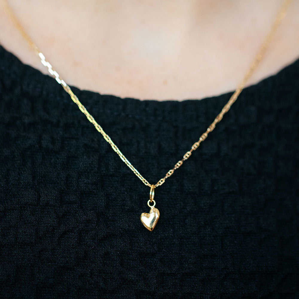 product_details::Hot Dog Chain Necklace and Gold Thousand & One Night Heart Charm on model.