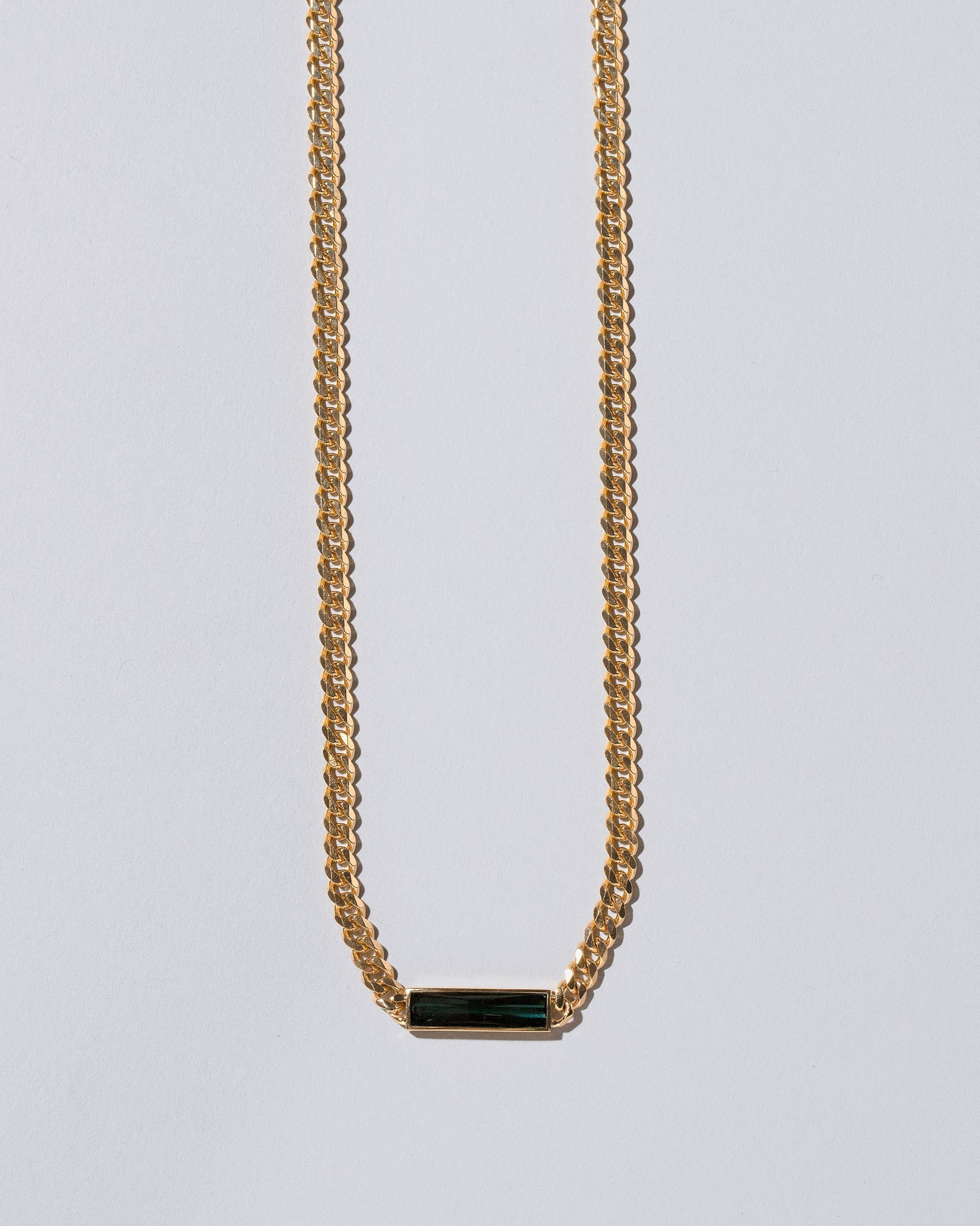 Closeup details of the Generosity Necklace on light color background.