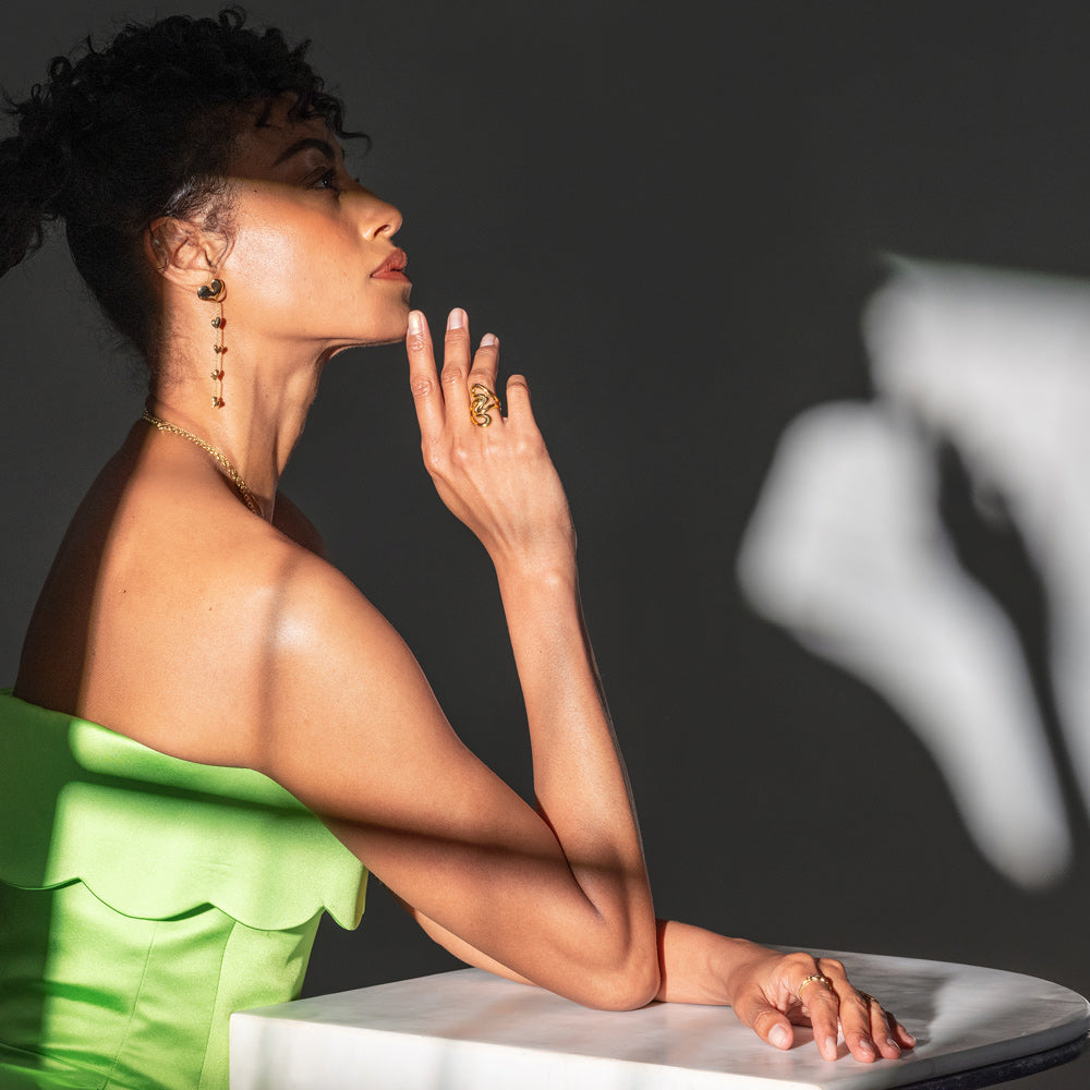 product_details::Styled image of models wearing jewelry from the Cut-Outs Collection.