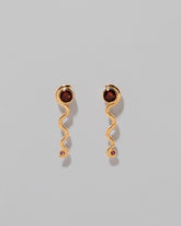 Disa Earrings on light color background