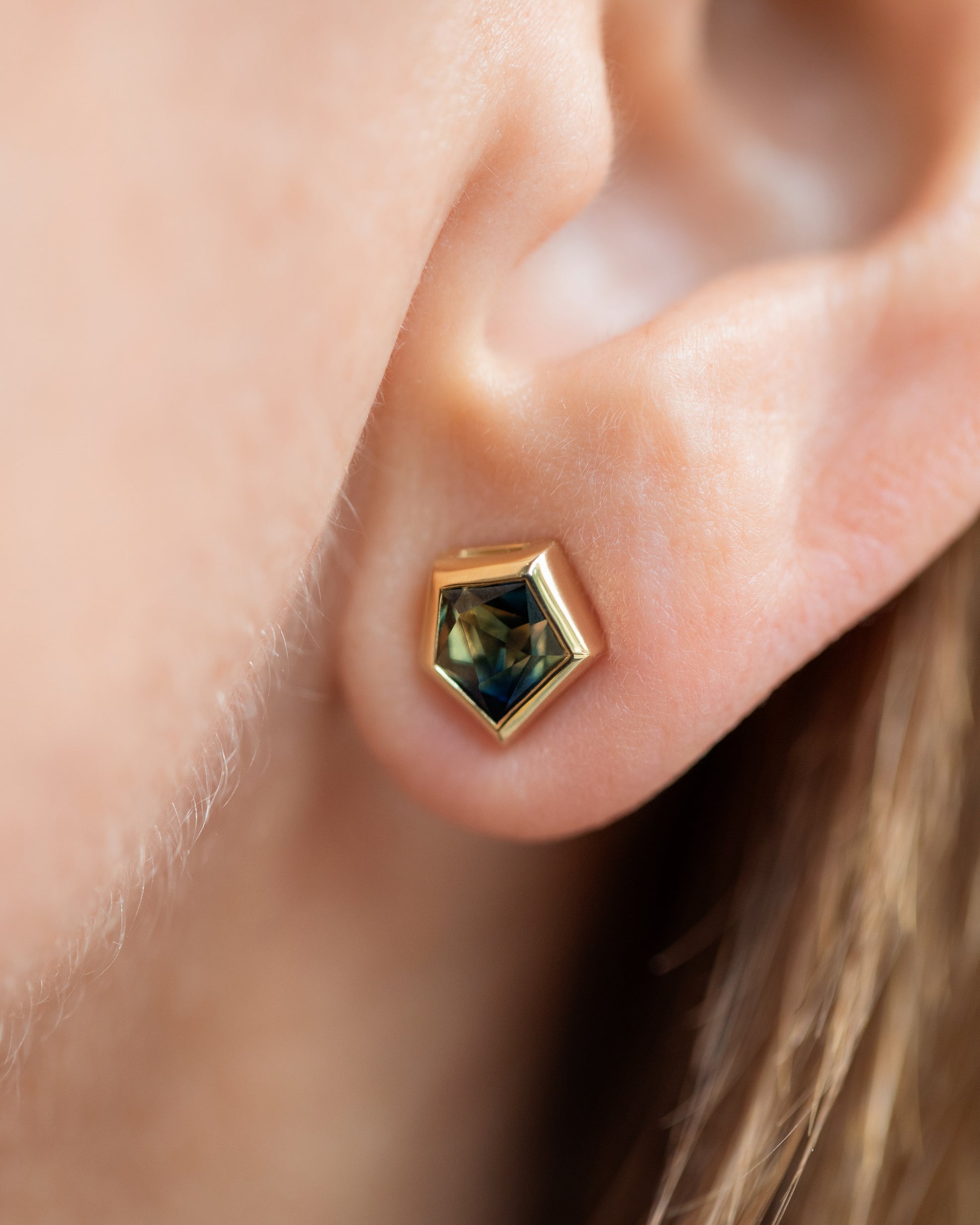 Green Bicolor Sapphire Geyser Stud Earrings on model.