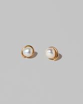 Nereus Earrings on light color background.