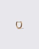Styling Huggie Hoop Earring Single on light color background.