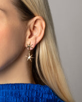 Gold Verve Star Drop Earrings on model.