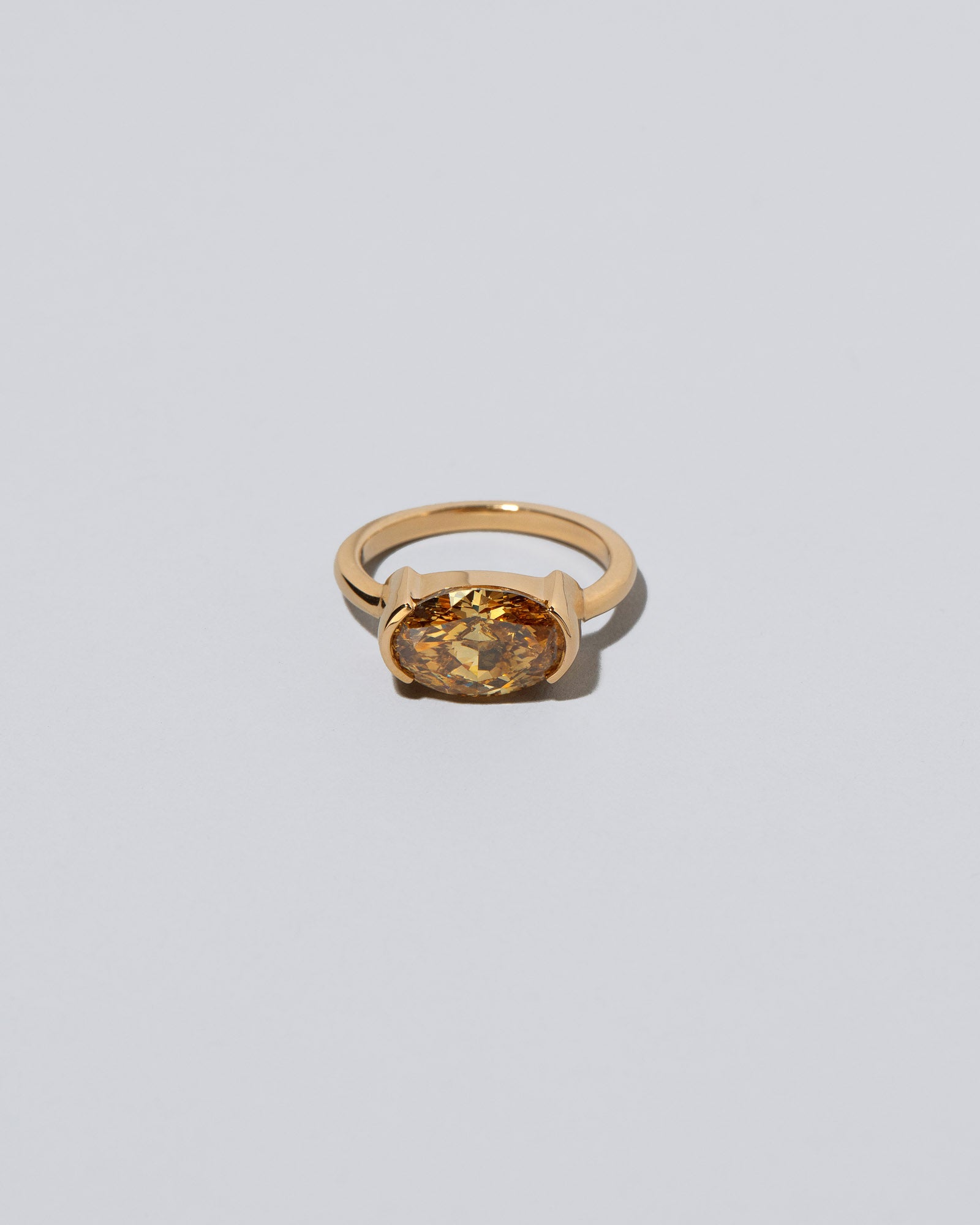Exhilaration Ring on light color background.