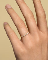 Gold White Diamond Fifteen Stone Dot Band on model.
