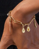 Loop Chain Bracelet with the Asparagus Charm, Halved Avocado Charms, Carrot Charm and Cauliflower Charm on model.