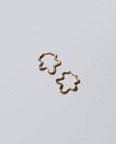 Gold Wild Poppies Hoop Earrings on light color background.