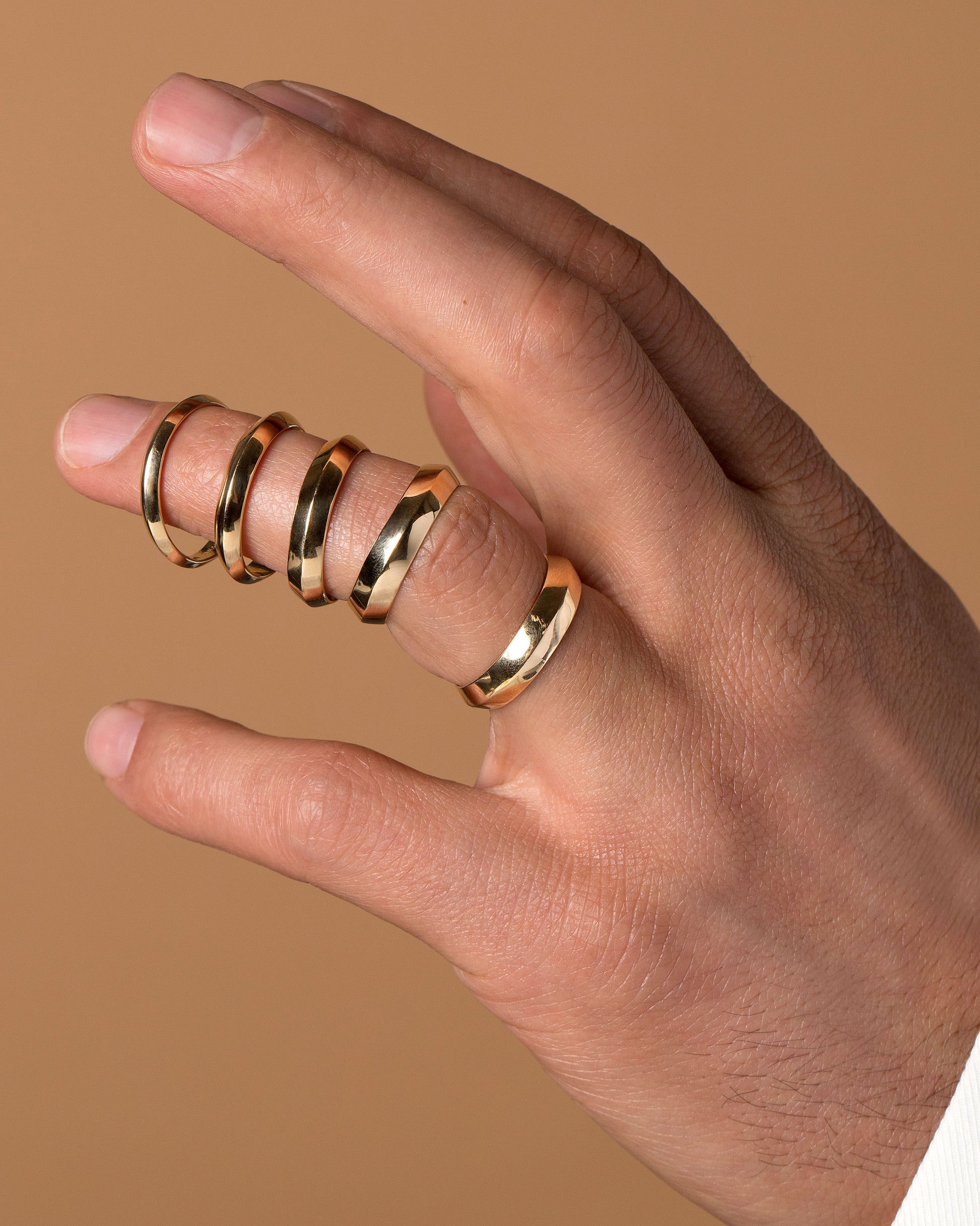 Gold Knife Edge Bands on male model.