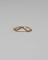 Gold Pavé Garnet High Peak Band on light color background.