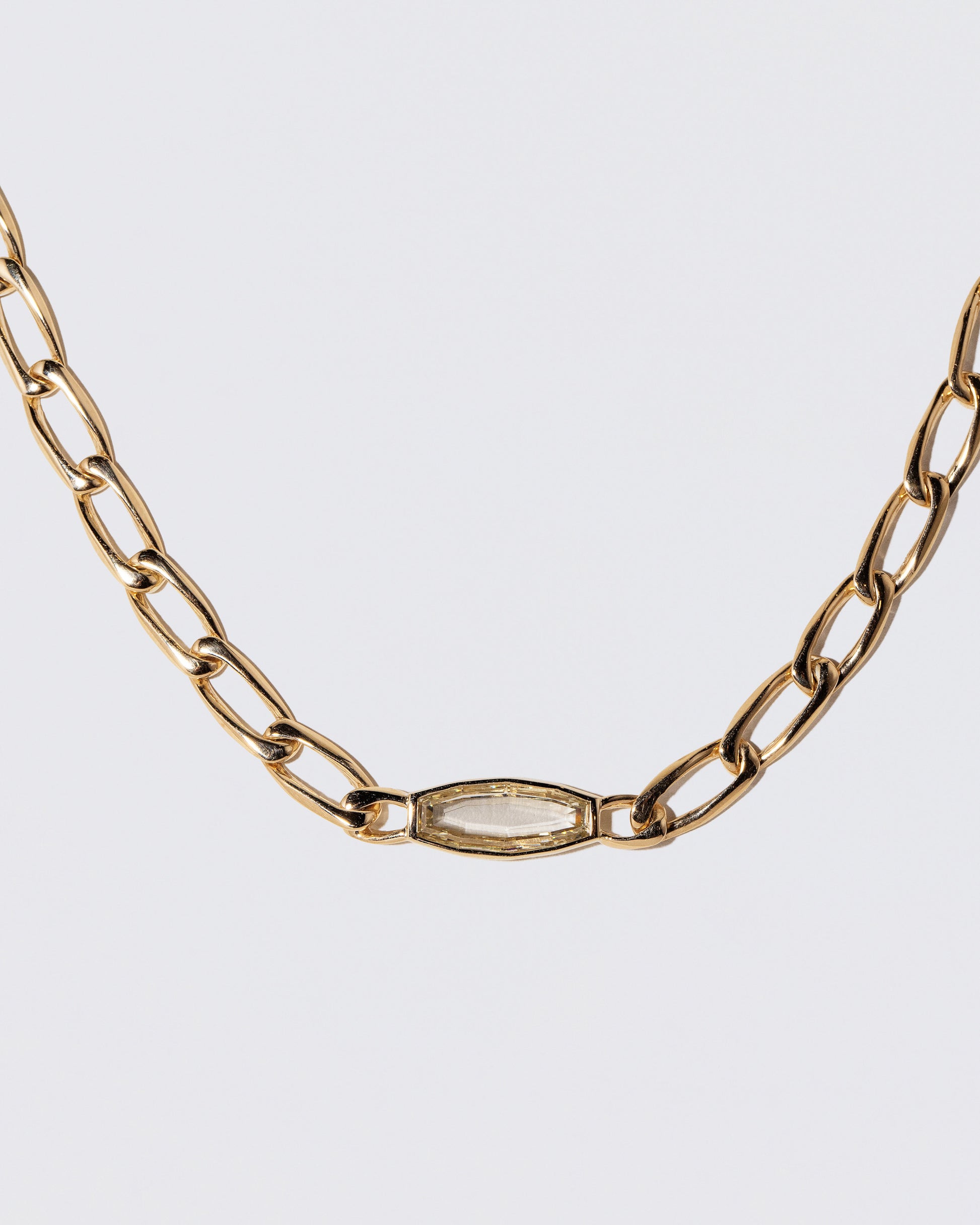 Closeup details of the Identity Chain Diamond Necklace 002 on light color background.