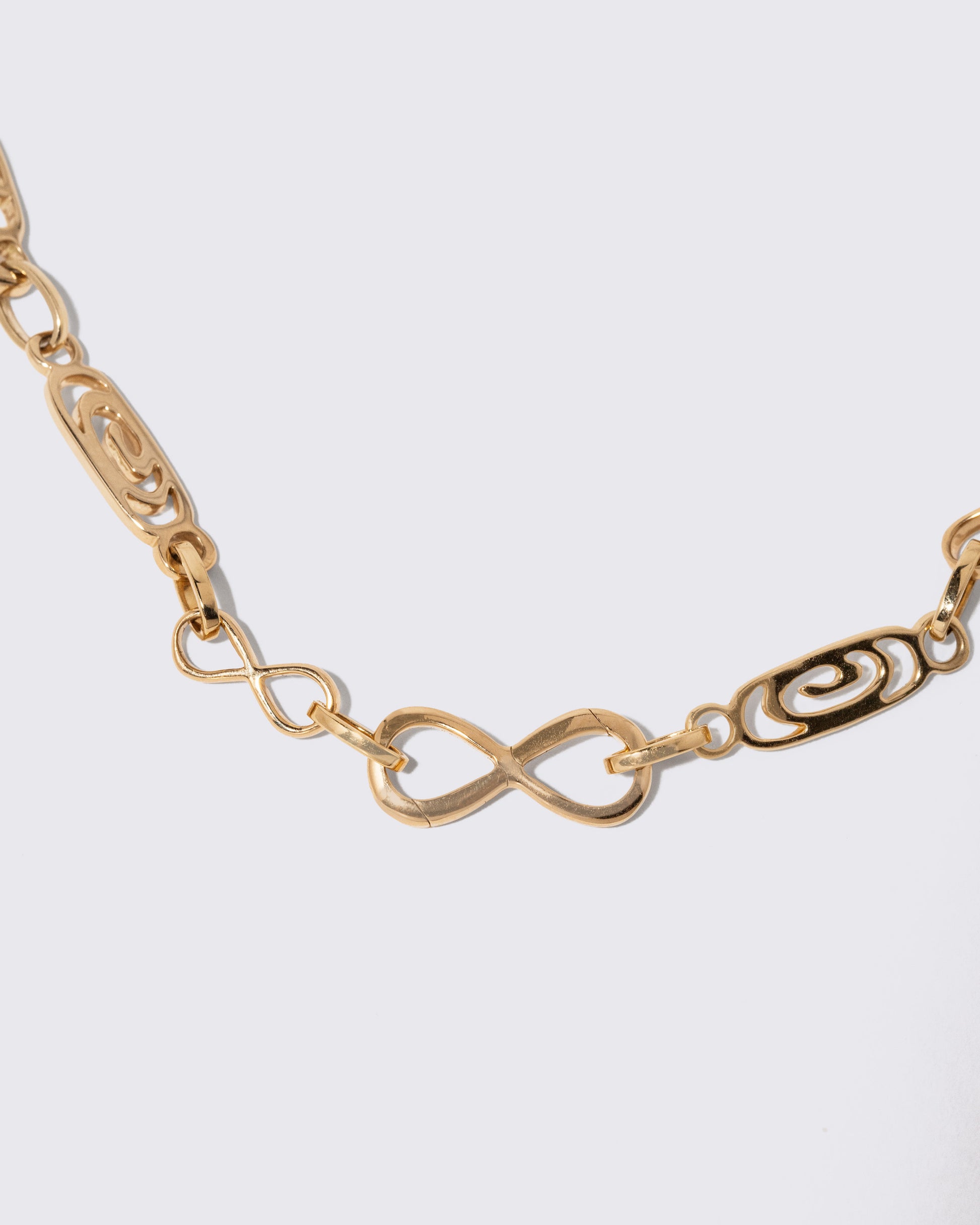 Detail view of the detachable Infinity Openable Link closure on the Infinity Openable Link Necklace on light color background.