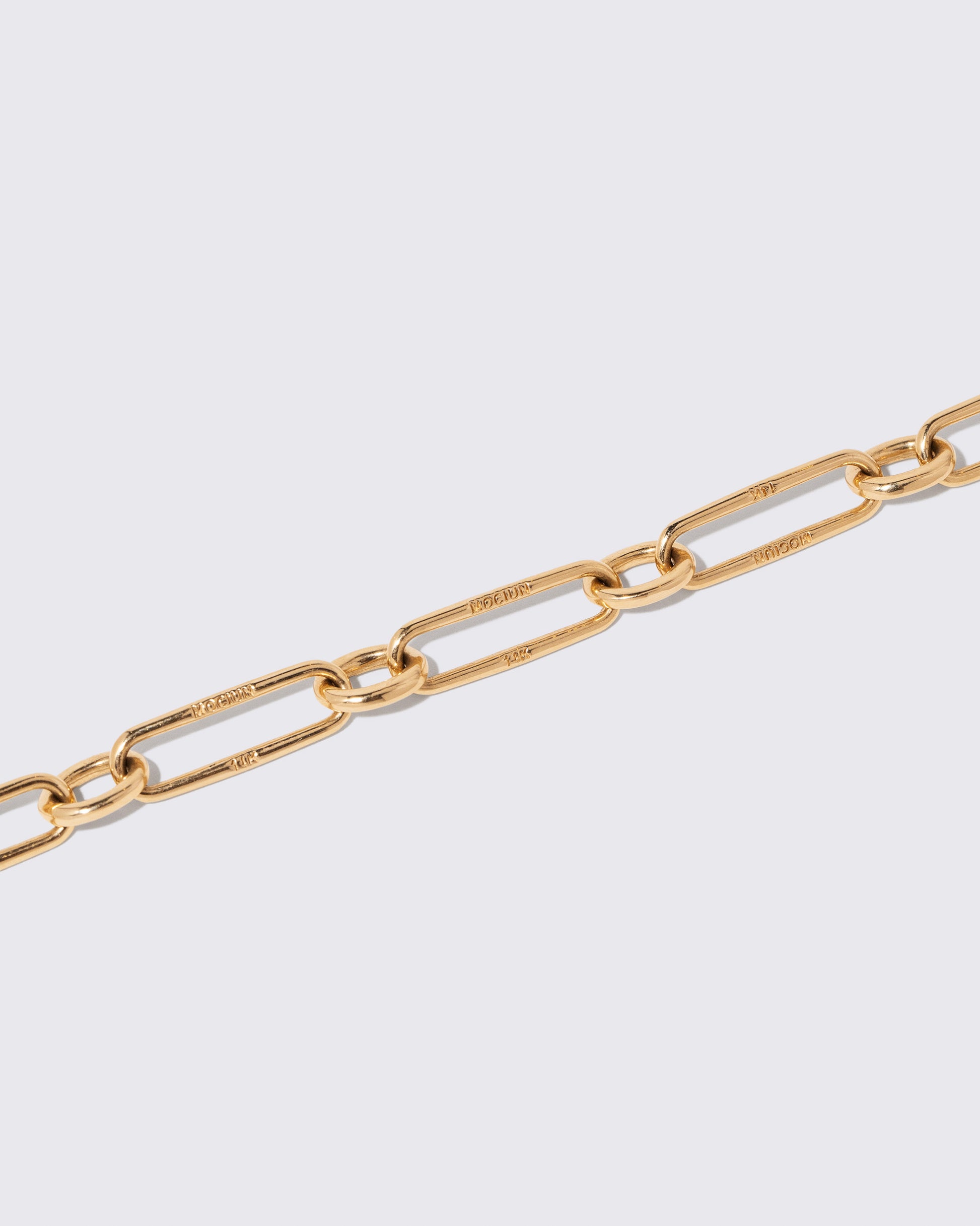 Closeup details of the Link Necklace on light color background.