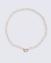 Animated detail view of the detachable Mociun Long Oval Openable Link closure on the Gold Pearl Openable Link Necklace and Diamond Poise Charm on light color background.