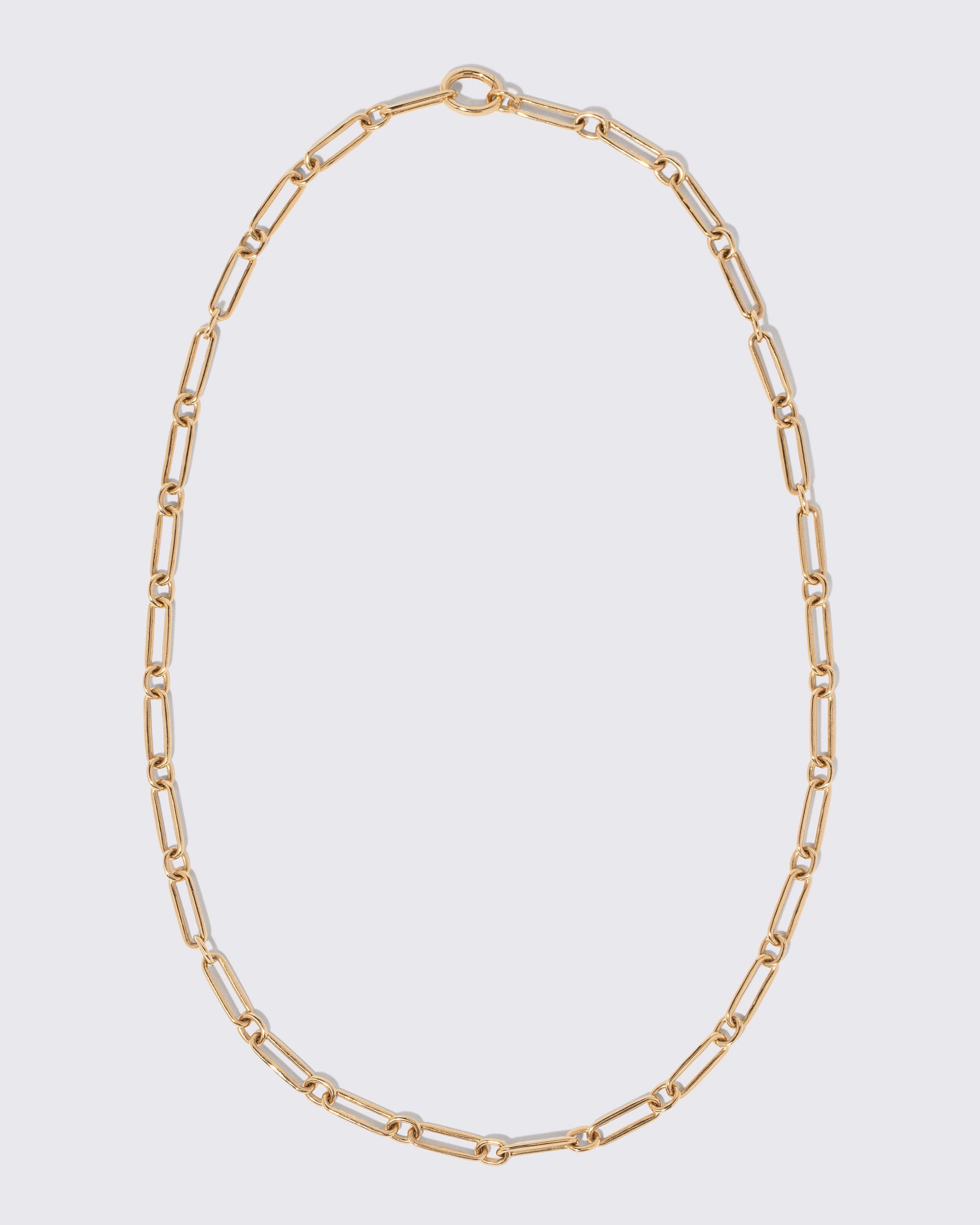 Petite Link Necklace on light color background.