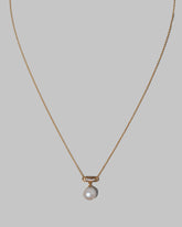 Closeup details of the Poseidon Necklace on light color background.