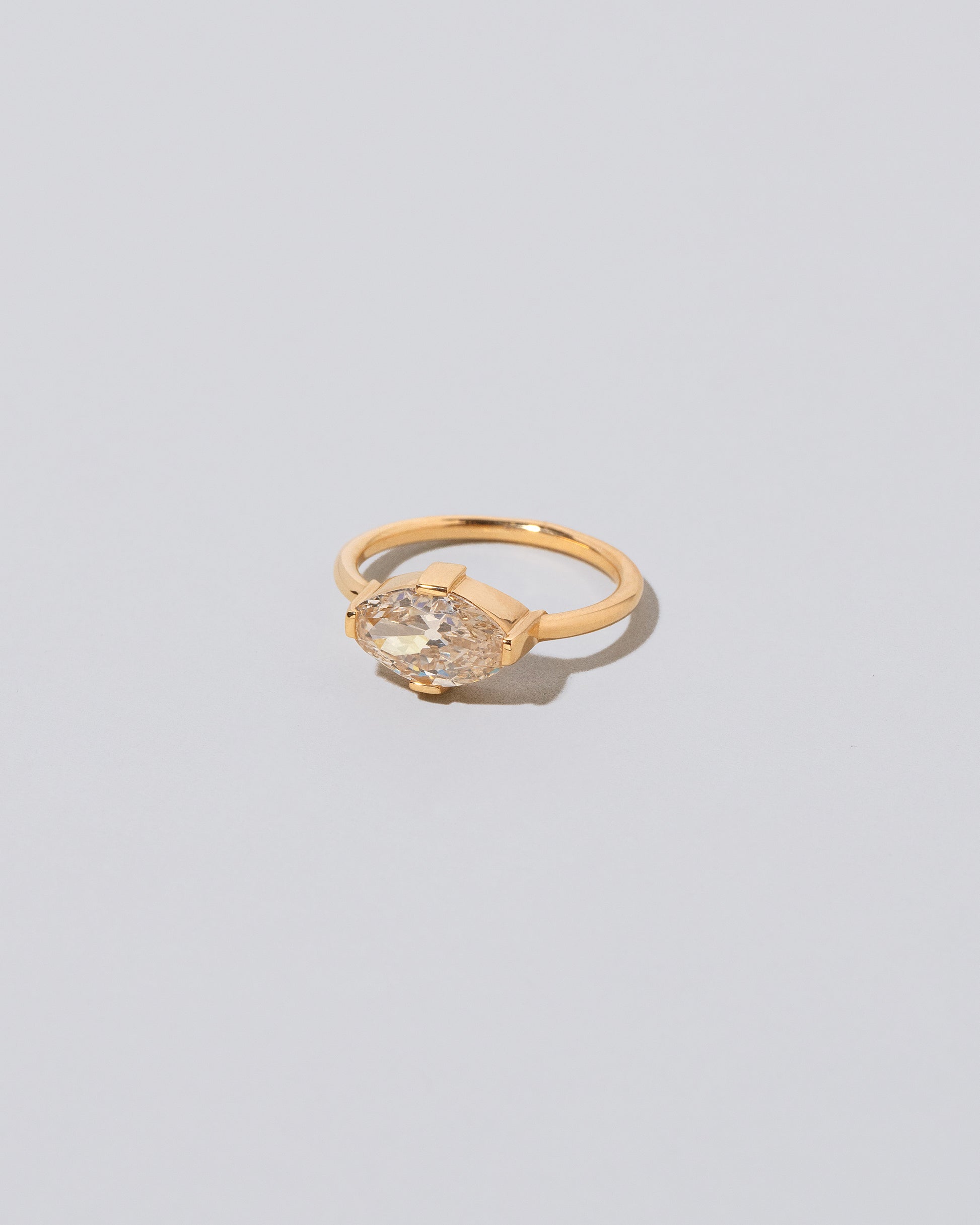 View from the side of the Eupheme Ring on light color background.