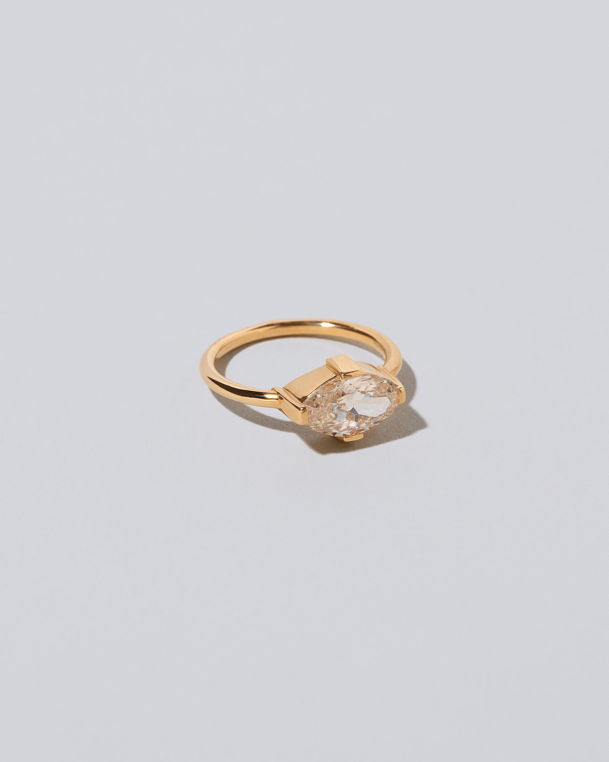 View from the side of the Eupheme Ring on light color background.