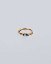 Blue Devant Ring on light color background.
