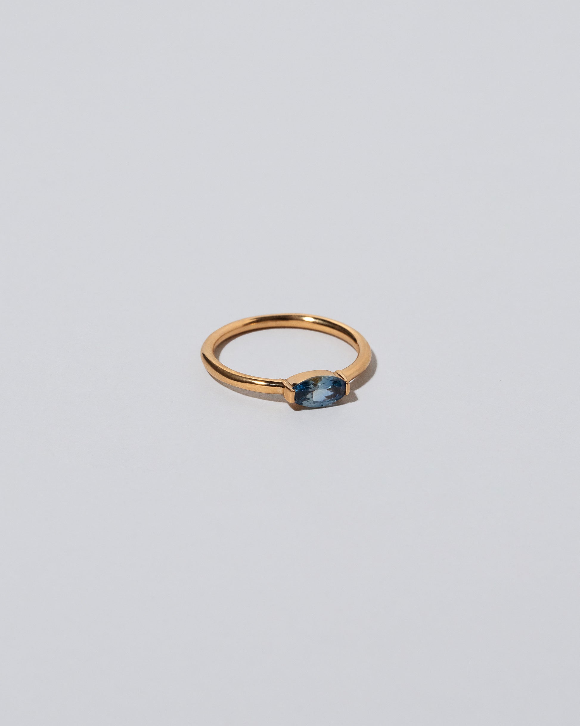 View from the side of the Blue Devant Ring on light color background.