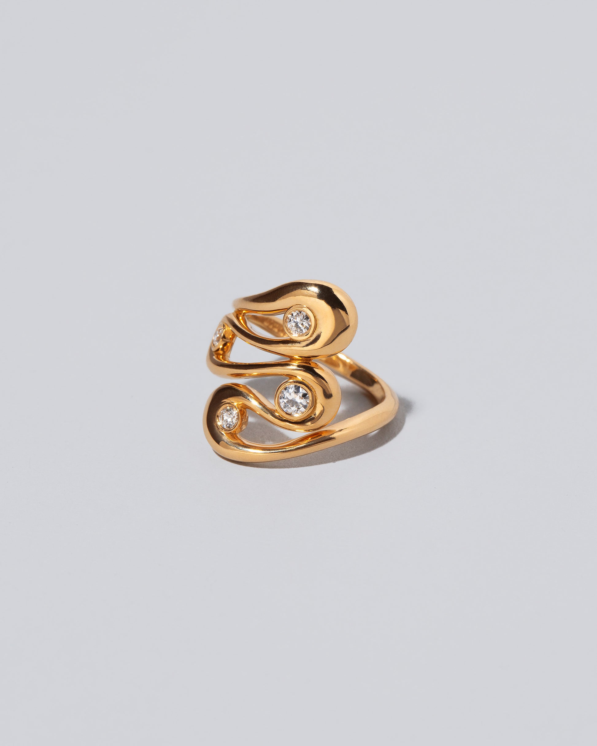 View from the side of the Swivel It Ring on light color background.