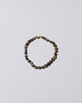 Tahitian Pearl Bracelet on light color background.