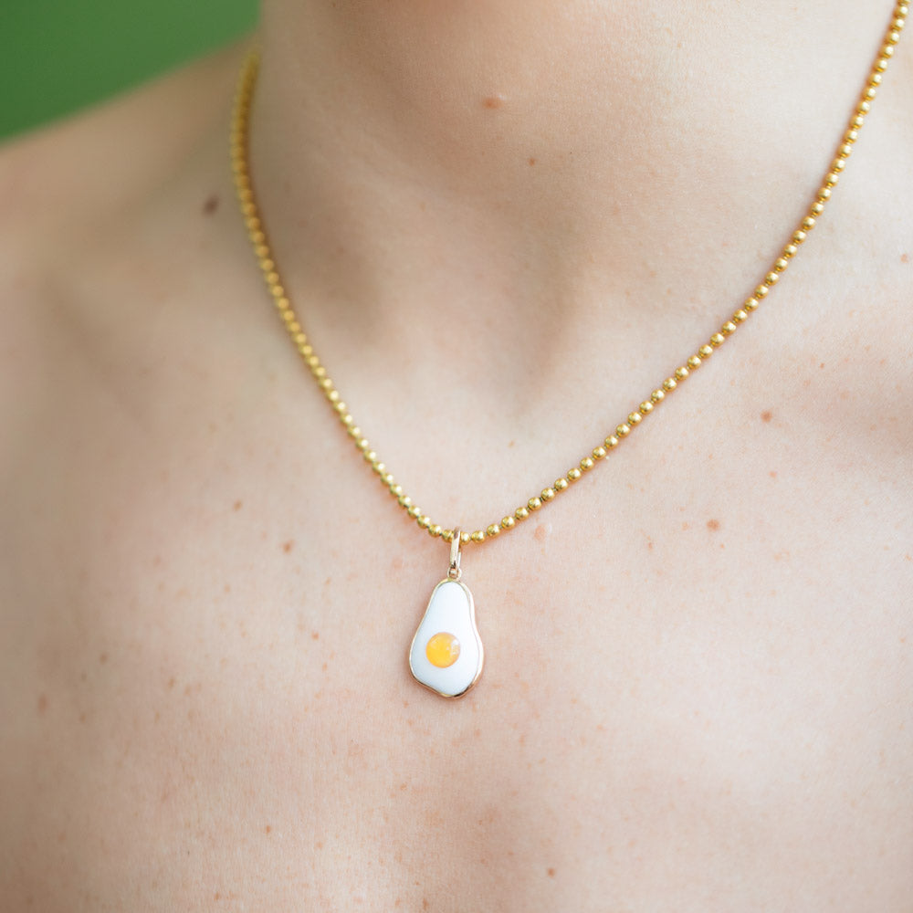 product_details::Vintage Ball Chain Necklace and Fried Egg Pendant on model.