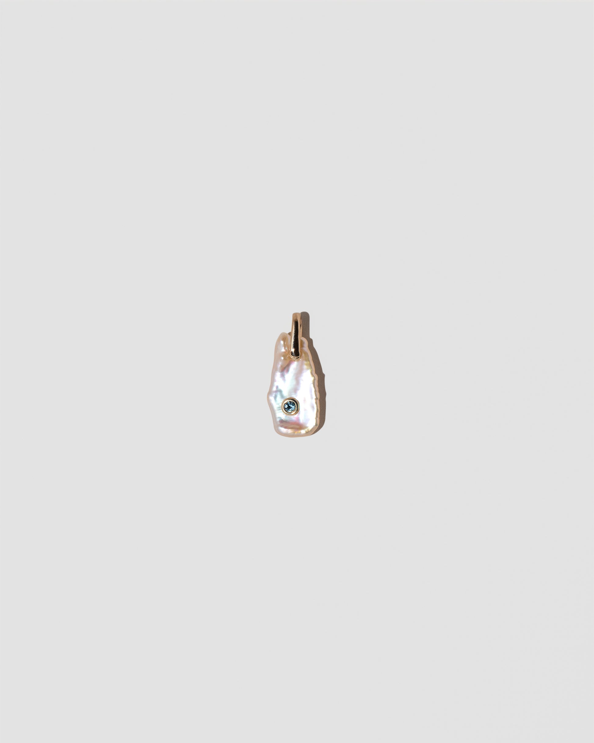 March Birthstone Pearl Pendant With Aquamarine on light color background.